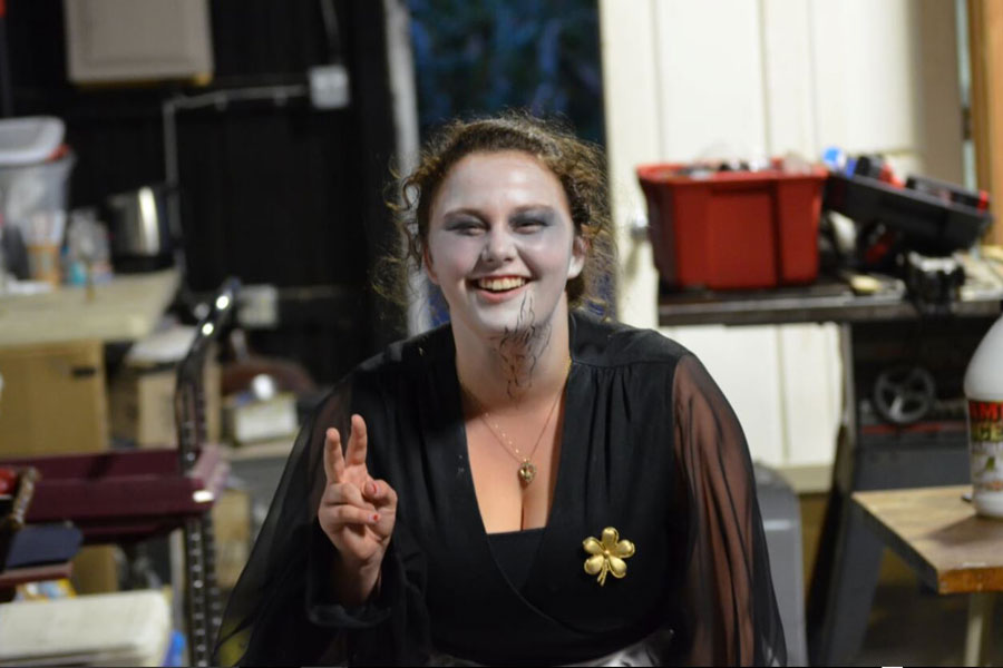 Senior Taylor Dorris poses after getting her makeup done at Legends of the Fog. Dorris volunteers there every weekend and plays the role of a dead bartender in the Farewell Hotel.