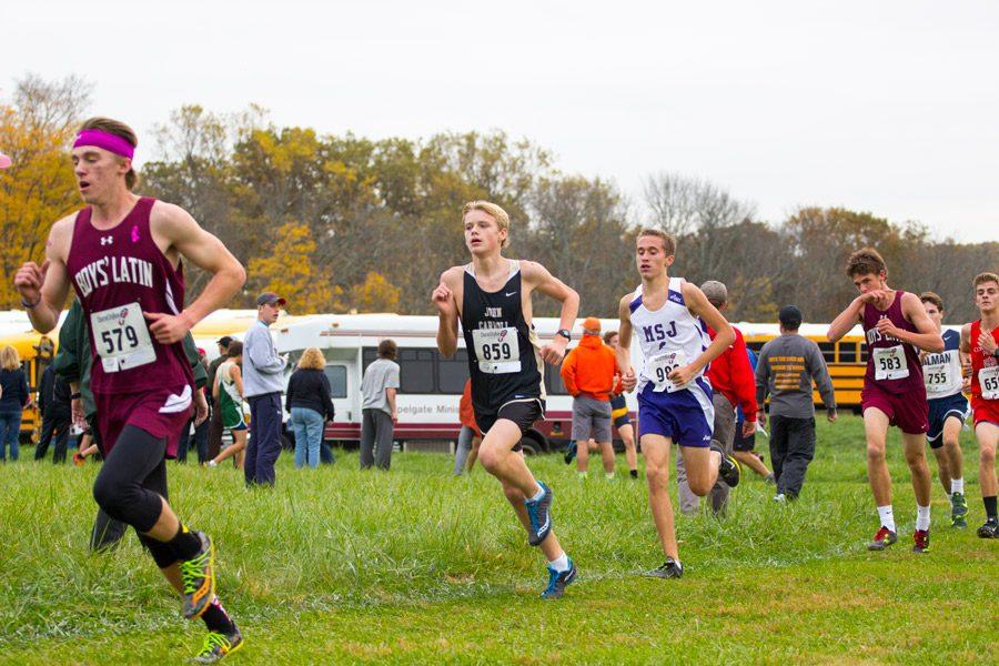 Sophomore Alexander Kirkland keeps pace with the top runners during the MIAA Cross Country Championships on Nov. 1. The mens cross country team placed second in the varsity B Conference with a score of 60 points.