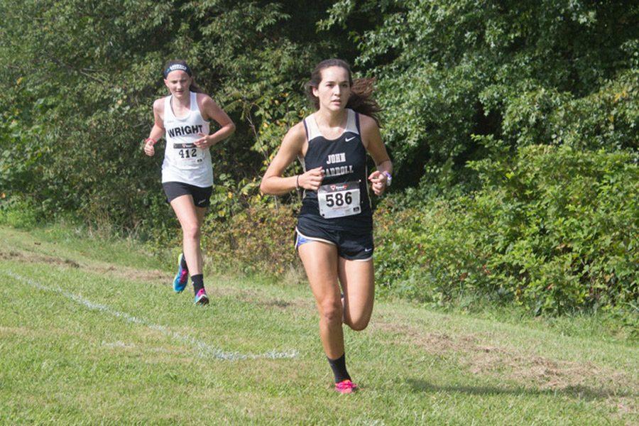 Junior Laura Amhrein passes an opponent on her way to the finish line at the Mustang Invite on Sept. 2. The womens cross country team finished with a 2-5 record in-conference this year.