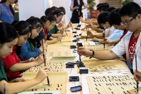 Students at the John Carroll School of Chongqing practice writing in Chinese during class. The school was established earlier this year and offers Chinese students a dual-program that combines American and traditional Chinese curricula.