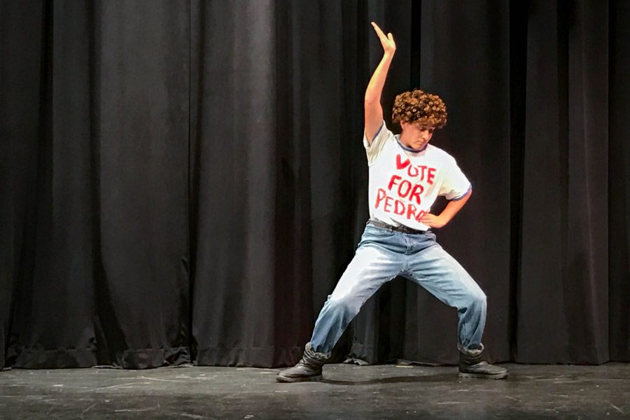 Senior Caroline Barwick mimics the moves to the famous Napoleon Dynamite dance during Variety Show rehearsal on Saturday, Nov. 19. The seniors raised over $8,200 towards their class budget.