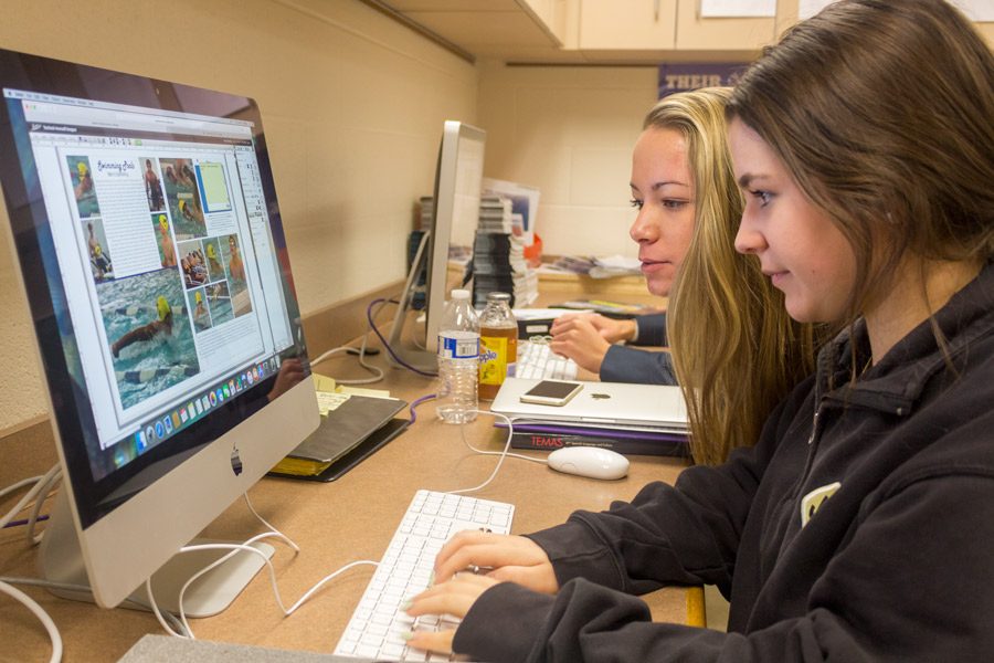 Seniors Giana Liberatore and Emily Schiavone (left to right) work on their swimming spread for the 2016-17 yearbook during class. The Pacificus recently won first place in the American Scholastic Press Association’s yearbook competition.

