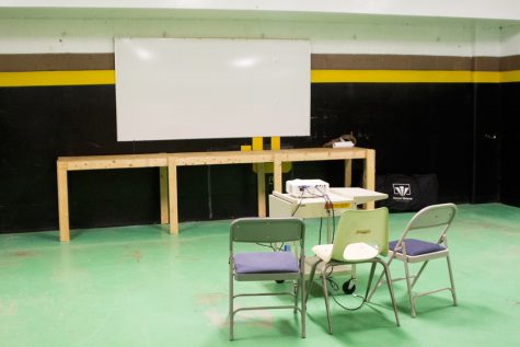 Chairs and a projector are set up in the new film room, which was converted from a storage room. Several athletic teams have used the new film room to watch highlights from previous games.