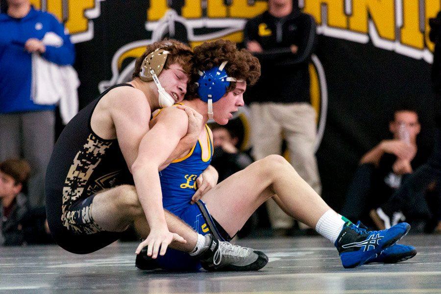 Senior+wrestling+captain+Eric+Ashton+controls+a+Loyola+Blakefield+wrestler+in+the+Parkville+Knightmare+Meet+on+Dec.+10%2C+finishing+in+first+place.+Ashton+has+wrestled+with+success+despite+only+wrestling+for+four+years%2C+and+has+earned+a+spot+in+the+top+25+of+his+weight+class+in+the+region+by+the+Maryland+State+Wrestling+Association.