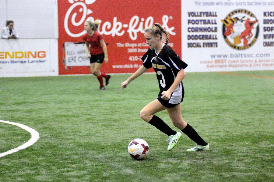 Senior Abby Hormes dribbles the ball in a game against Friends School on Friday, Jan. 20. The womens indoor soccer team finished the regular season with a final record of 7-2-2, and won the IAAM A Conference Championship on Friday, Feb. 4.