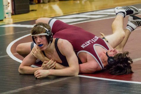 Sophomore Zack Haskell has his opponent in a crucifix hold during a tri-meet at Boys Latin School of Maryland. JC faced Boys Latin and Gilman on Feb.1 and lost both matches 36-40 and 24-42, respectively.