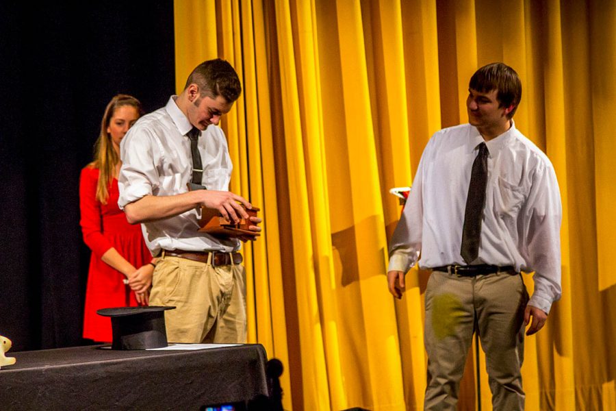 Seniors Arri Stakias and Steven Kutcher (left to right) preform a trick during their magic show on Friday, Feb. 10. Kutcher and Stakias held a magic show in the auditorium from 3:15 p.m. to 4 p.m. as part of Kutchers senior project. 