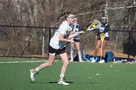 Senior midfielder Abby Hormes advances up the field on attack. Hormes also competes on the soccer, indoor soccer, and indoor track teams.