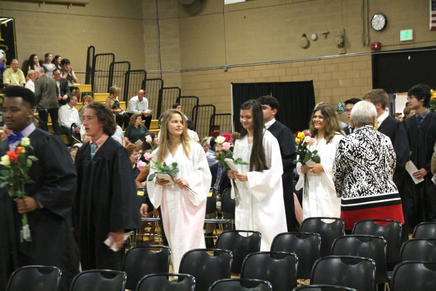 Members of the class of 2016 process into the Upper Gym for their Baccalaureate Mass. This year, the Mass is being held at Saint Margaret Church instead of at JC. 
