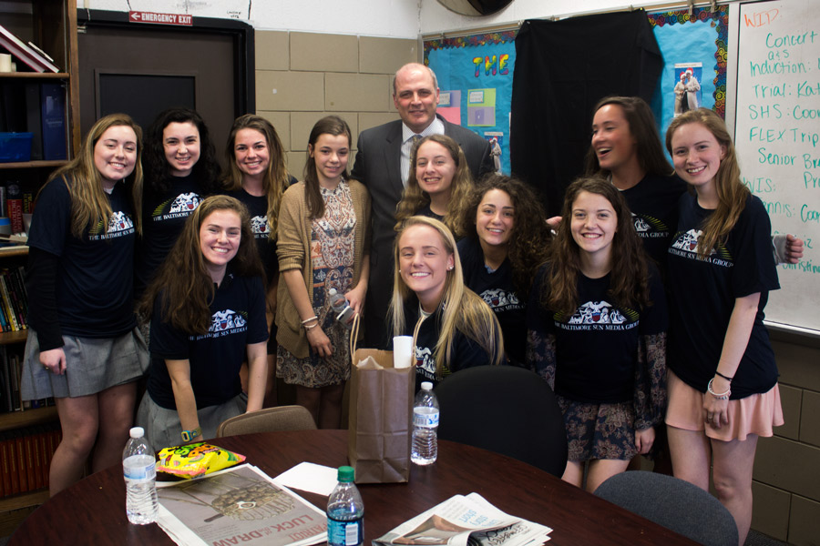 Members of The Patriot staff pose for a picture with Alatzas and his daughter, Jamie, while wearing shirts from The Baltimore Sun. After the ceremony, Alatzas and his daughter ate lunch with the staff and continued their discussion about being a professional journalist. 