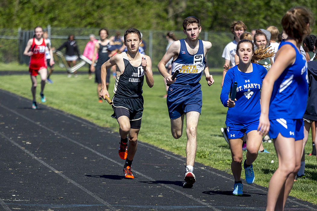  Sophomore Wyatt Moran works his way around a competitor in the 4x800 meter relay MIAA and IAAM B Conference Championship on May 3. At the B Conference Championship, the team placed second to Saint Vincent Pallotti.