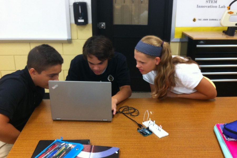 Sophomores Matt Fabiszak, Cole Jones, and Alexis Loder work on an interactive project during their STEM meeting. Having a similar program for humanities would allow students with a strength in the liberal arts to participate in a hands-on program such as this one.