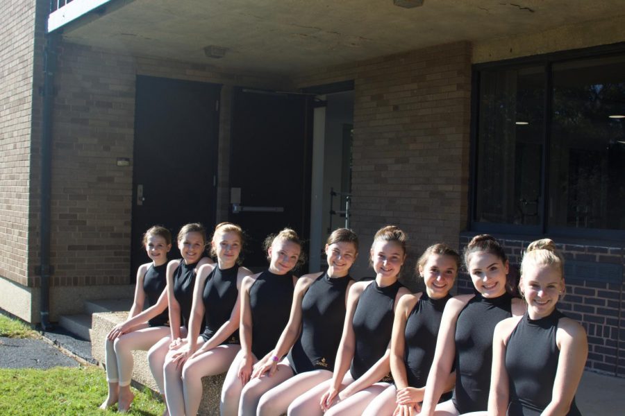 Freshman Anna Webb, Freshman Grace Madigan, Junior Madison McFerren, Freshman Riley Humes, Junior Caitlin Kerrigan, Freshman Gabby Clark, Freshman Kaylee Copensphire, Junior Emily Mclauchlin, and Freshman Giovanna Ward sit out of side of St. Josephs Hall before ballet class. All nine students auditioned and were selected for the College Preparatory Dance Program. 