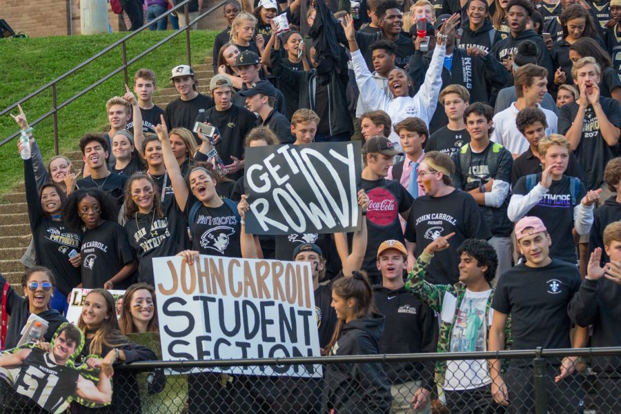 A large group of students cheer on the varsity football team at a home game against Loyola Blakefield on Friday, Sept. 8. Student support like this, however, is not always visible at events of under-recognized teams.