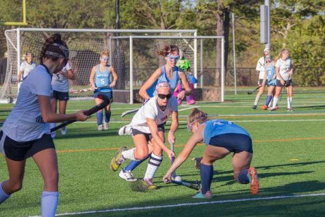 Senior Ashlee Kothenbeutel takes the ball from a Mount de Sales player on Monday, Oct. 30. The varsity field hockey team lost 2-1 in the IAAM B Conference quarterfinals.