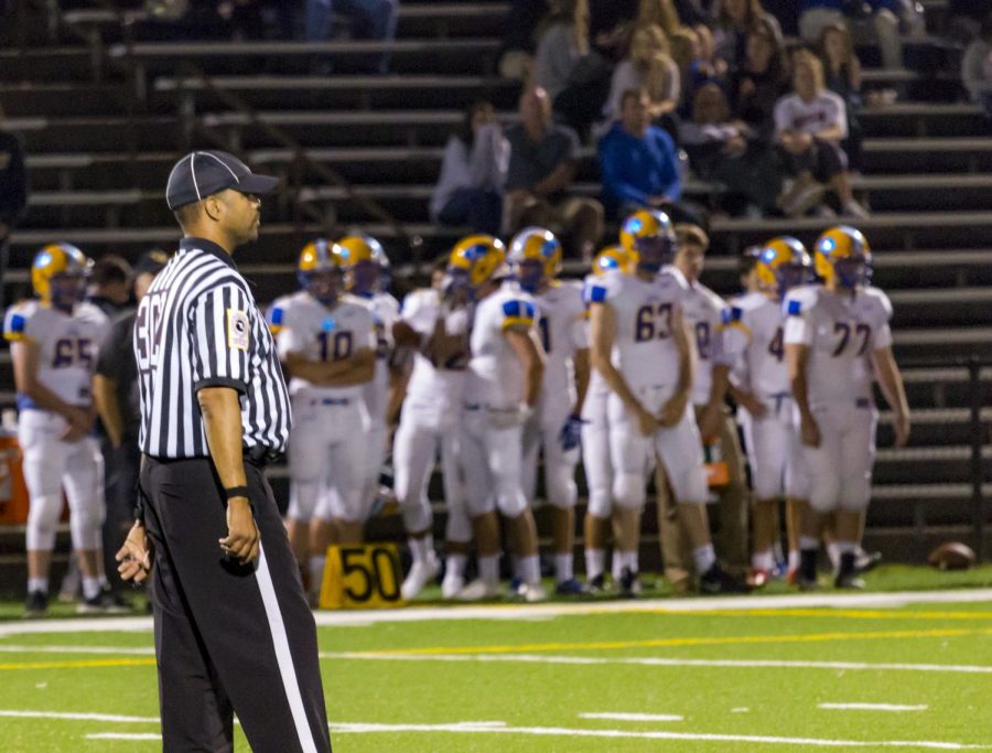 A referee focuses on a play during a JC football game versus Loyola Blakefield on Friday, Sept. 8. Every call referees make is judged by players, coaches and fans alike.