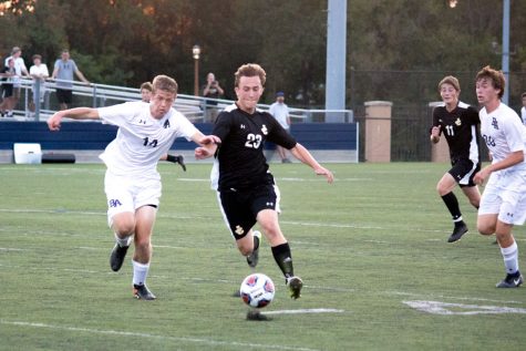 Senior striker Auggie Van Dalsam defends the ball from an opponent during a game against Bel Air on Sept. 16. JC lost 0-3.