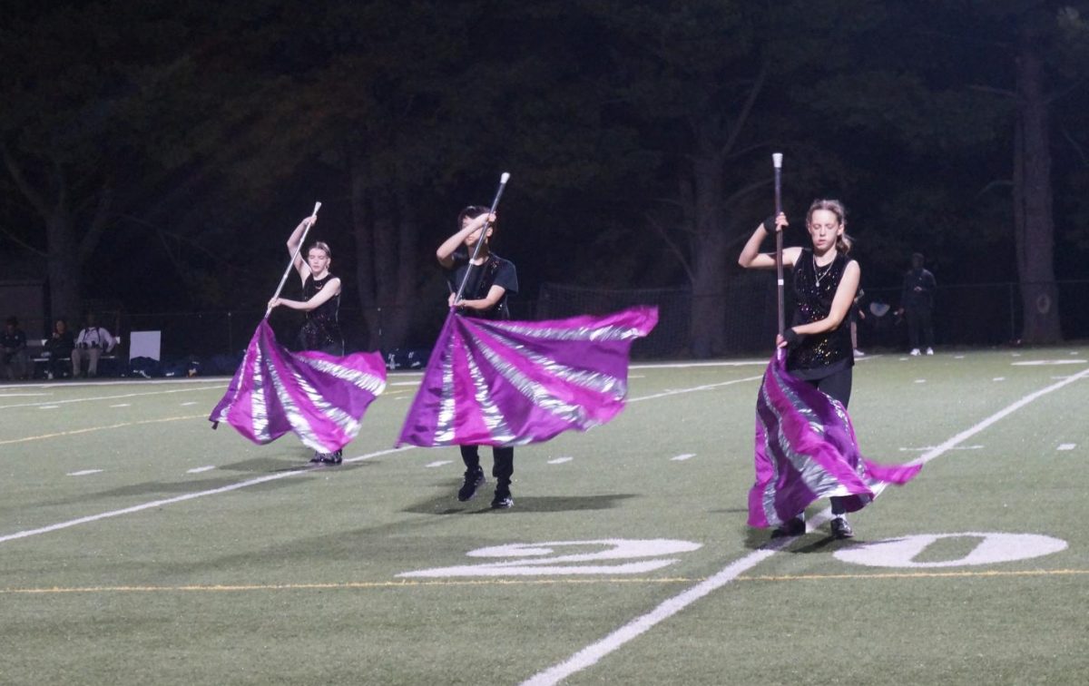 Color+guard+enhances+performance+of+marching+band