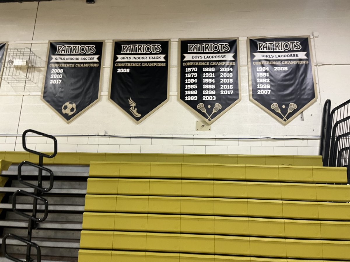 New championship sports banners displayed in the Upper Gym
