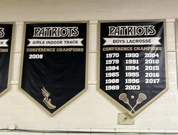 New championship sports banners displayed in the Upper Gym